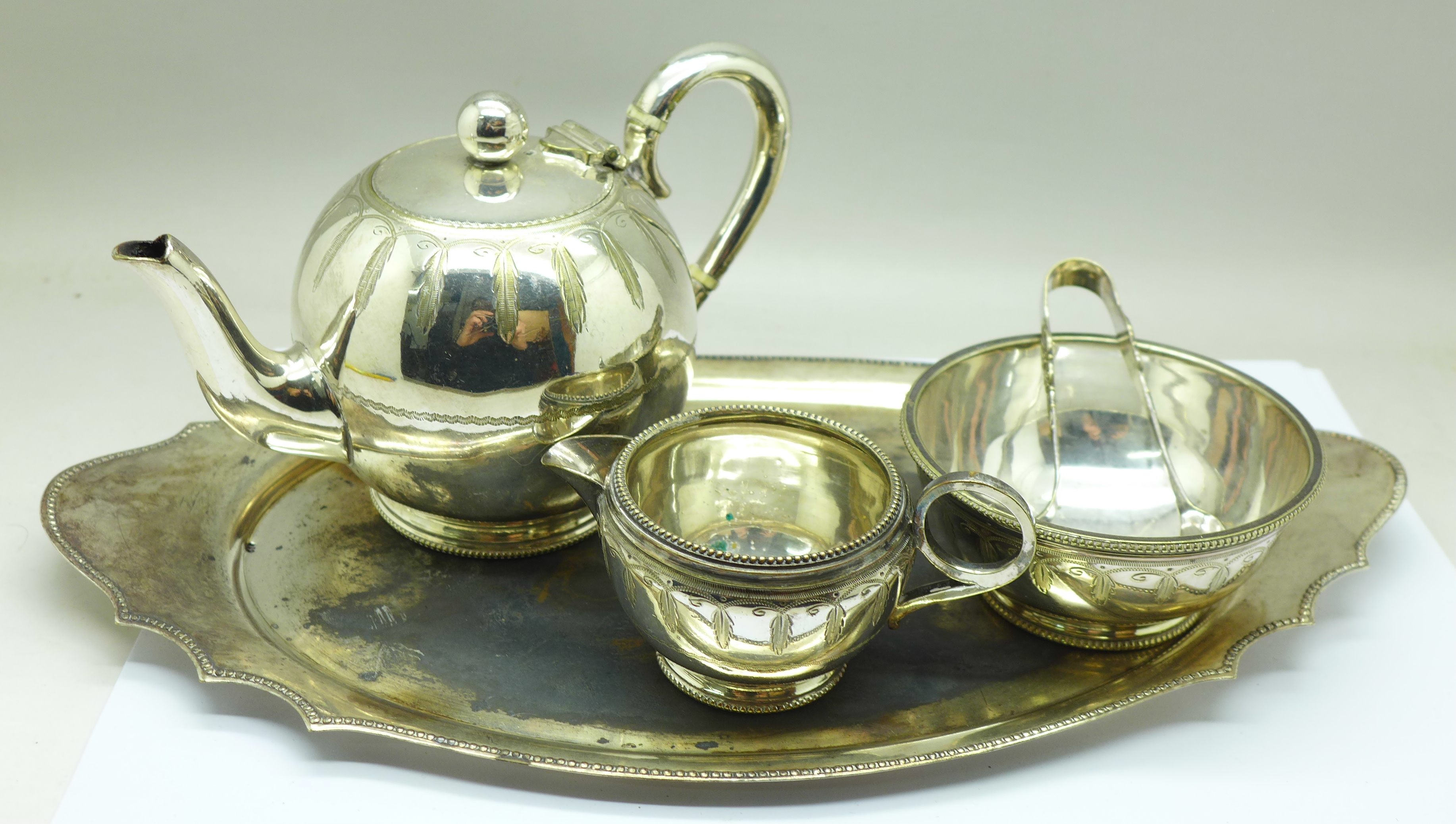 A Victorian Mappin & Webb bachelor silver plated teaset on tray, engraved decoration