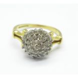 An 18ct gold, diamond cluster ring, 3.3g, M