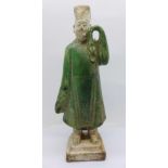 A Chinese pottery Mingqi tomb guardian attendant figure, 19.5cm