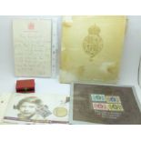 A printed handwritten letter from Queen Elizabeth II, a Coronation medal, a Royalty £5 coin and