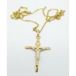 A 9ct gold cross pendant and chain, 2g