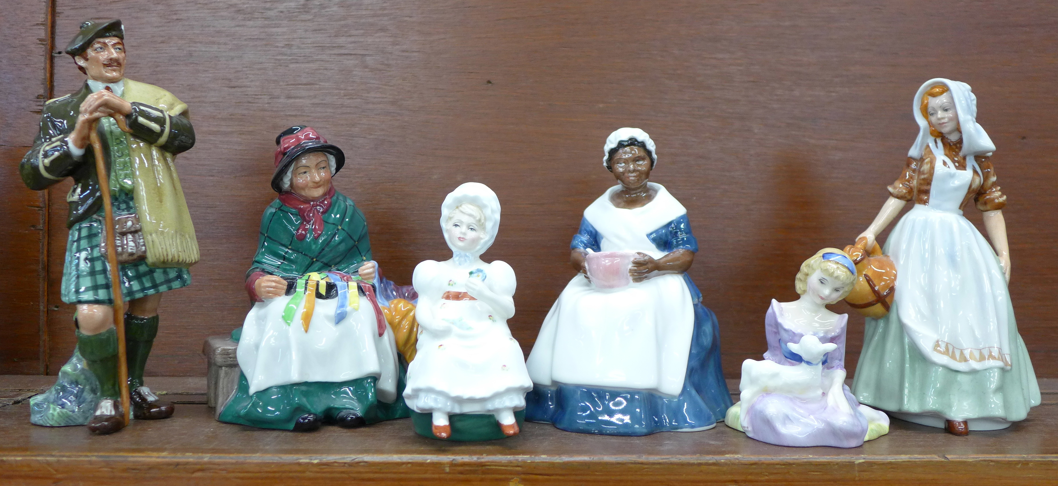A collection of six Royal Doulton figures, including The Laird, The Milkmaid and Silks and Ribbons