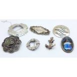 A Victorian silver anchor brooch and six other brooches