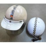 Two vintage motorcycle helmets