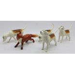 Four Beswick hounds, one a/f, and a fox