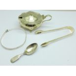 A silver mustard with liner, a pair of Victorian silver sugar bows, a small silver caddy spoon and a