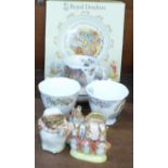 Three Royal Albert Beatrix Potter figures, three Royal Doulton cups and saucers and a christening