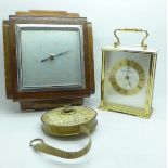 A lawn tennis measuring tape, an oak barometer and a clock