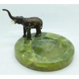 After Franz Bergman, green onyx dish with a cold painted model of an elephant with keeper, tusks a/f