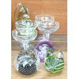 Four Babycham glasses, a M'dina and a Caithness glass paperweight, and two other paperweights