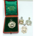 Four silver fobs, two with applied gold, one boxed, 38g