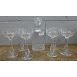 A glass decanter with six matching cut and etched wine glasses **PLEASE NOTE THIS LOT IS NOT