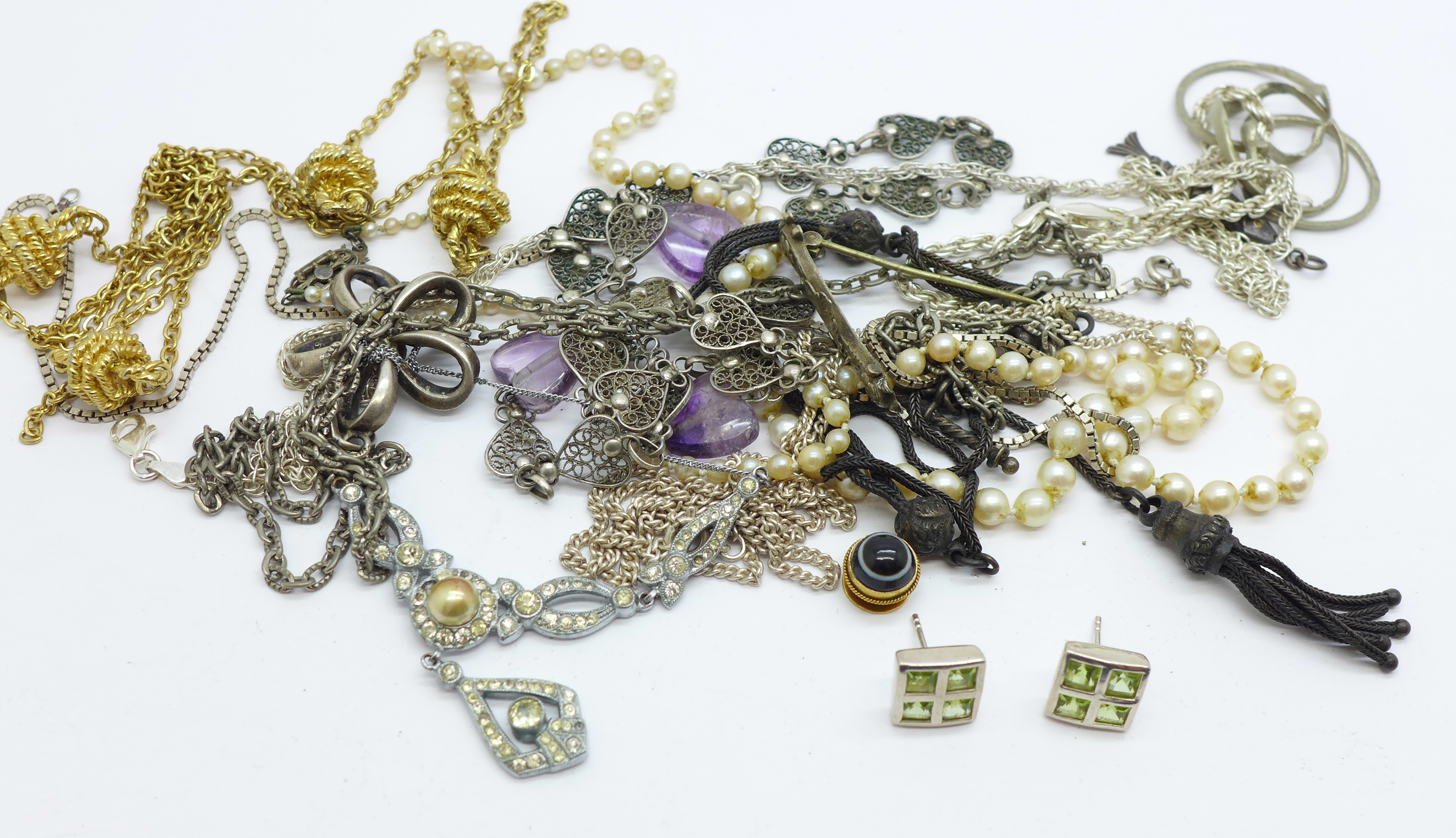 Costume jewellery including a silver brooch and a heart necklace