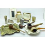 A collection of pipes, cigarette lighters, etc.