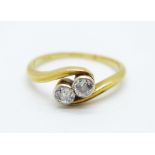 An 18ct gold and diamond crossover ring, approximately 0.25carat diamond weight, 2.7g, M