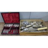 A cased set of plated spoons and sugar bows and a box of mixed silver plated cutlery **PLEASE NOTE