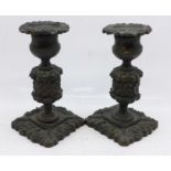 A pair of bronze candlesticks, 11cm