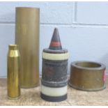 A '25 pounder' military shell case marked 1955, one similar 30mm shell case, a brass drill round