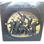 The Beatles interest, Band on The Run album autographed by Christopher Lee and James Coburn
