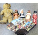 A jointed Teddy bear and other costume dolls