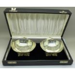 A pair of white metal bon bon dishes, cased