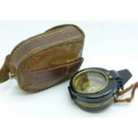 A pocket compass with leather case