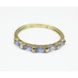 A 9ct gold ring set with five tanzanite stones, 1.2g, O