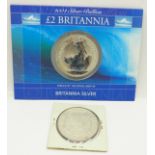 A 2004 Britannia £2 silver coin and an 1886 Morgan silver dollar