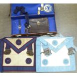 A leather Masonic case with aprons, medals and pouch