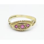 A 9ct gold and three stone ruby ring, 1.3g, L