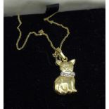 A 9ct gold cat pendant on a fine 9ct gold chain, 1.4g