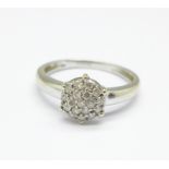 A 9ct white gold, diamond cluster ring, 2.1g, M