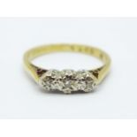 An 18ct gold, platinum set three stone diamond ring, 2.3g, K