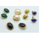 Four pairs of 14k gold clip on earrings and a pair of 14k gold screw back earrings, total weight