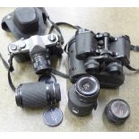 A pair of Prinz 8x30 binoculars, a Pentax Asahi 35mm film camera and three other lenses