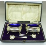 A pair of silver salts and spoons in a fitted case, Walker & Hall, 110g
