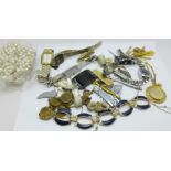 A 9ct gold locket and chain, 2g, lady's wristwatches and other mixed jewellery, tie clips and a