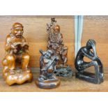 Three Eastern wooden carvings and one other carving