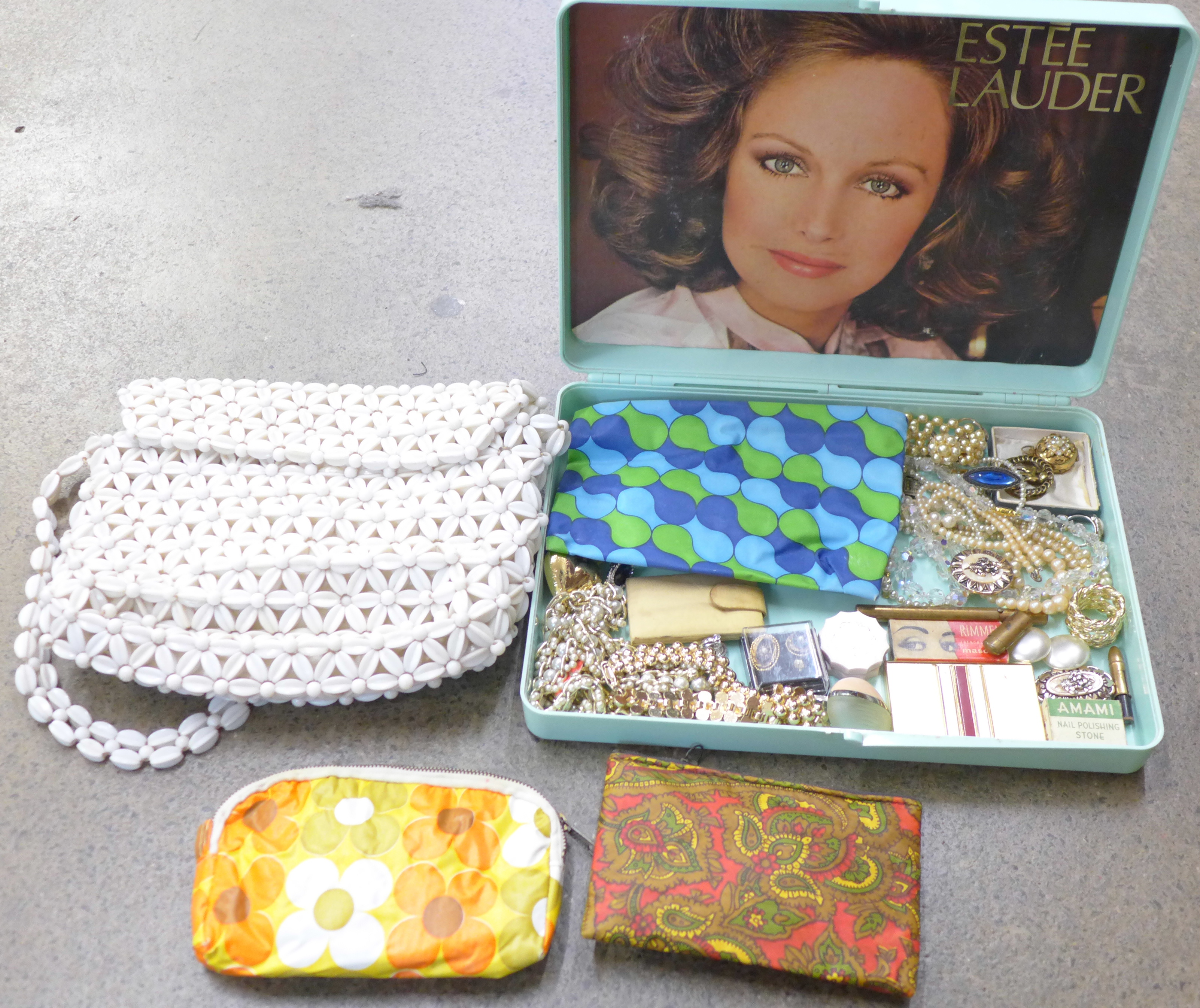 An Estee Lauder box with vintage make up bags, compact, costume jewellery and a bead bag
