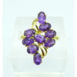 A silver gilt and amethyst cluster ring, R