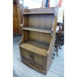 An Ercol Golden Dawn open bookcase