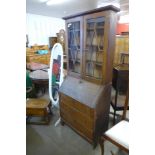 An oak bureau bookcase