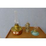 A Victorian copper and brass oil lamp and two others