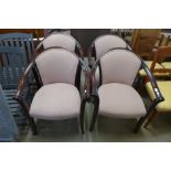 A set of four mahogany and upholstered tub chairs