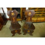 A pair of 19th Century painted armorial mahogany chairs