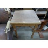 A small oak draw-leaf table