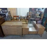 A walnut chest of drawers and dressing table