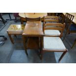 A pair of Danish Dyrlund teak chairs, a teak trolley and a Danish teak tiled top nest of tables