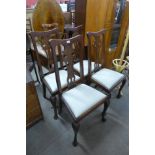 A set of four George III style mahogany dining chairs