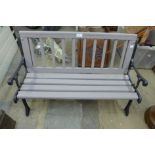 A child's cast alloy garden bench